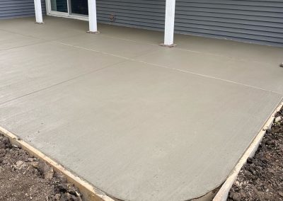 Broom finished concrete patio under deck