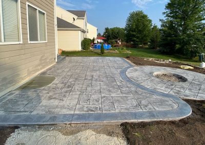 Stamped concrete patio and firepit